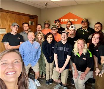 Employee by SERVPRO sign.