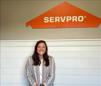 Employee by SERVPRO sign.