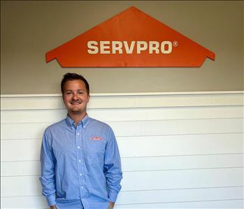 Employee by SERVPRO sign.